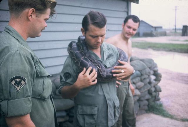 3 members of the medical platoon wmascot Julius Squeezer    ten foot anaconda